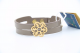 دستبند چرم و طلا طرح اسلیمی فرم گل و برفدانه کد CL035